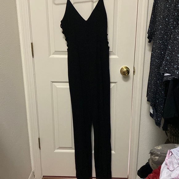 Beautiful black romper! Has cute side detailing in both sides! Only worn 2 times - Picture 1 of 4